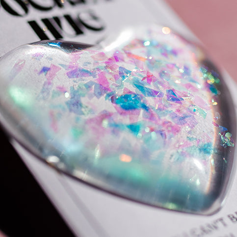 close up of holographic flecks in resin, pocket hug, resin heart, 